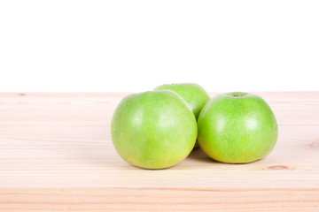 Green apples on the wood