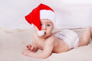 Beautiful little baby celebrates Christmas.