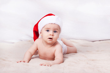 Beautiful little baby celebrates Christmas.