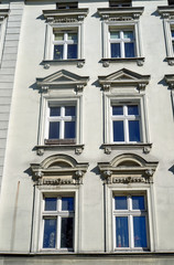 Fototapeta na wymiar Windows on the facade of the Art Nouveau building in Poznan.