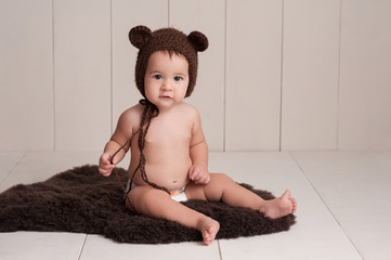 Baby Wearing a Bear Bonnet