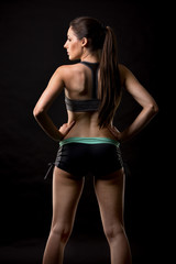 Fototapeta na wymiar fitness woman on black background