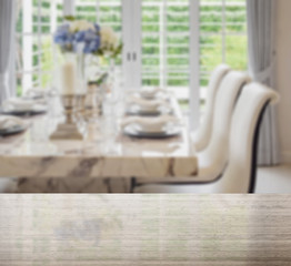 granite table top and blur of dining table and comfortable chair