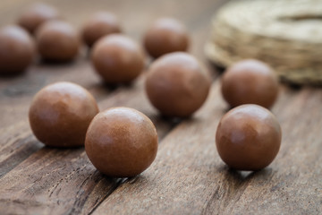 Chocolate balls on wooden background