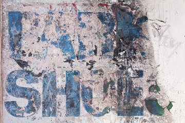 Old faded sign on a wall