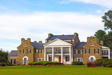 Glenview historic mansion with formal gardens at sunset. Historic Mansion at Civic Center Park in Rockville, Maryland, USA