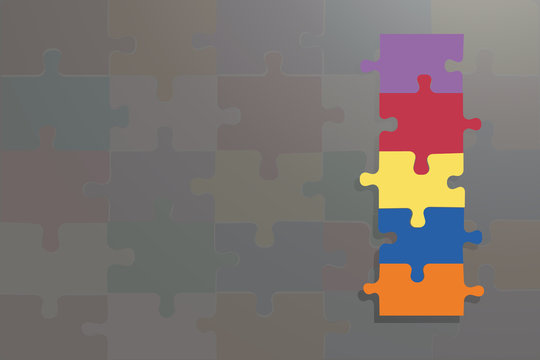 Four colorful puzzle pices on the grey background