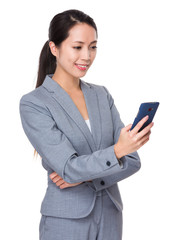 Fototapeta na wymiar Asian Young Businesswoman read the message on cellphone