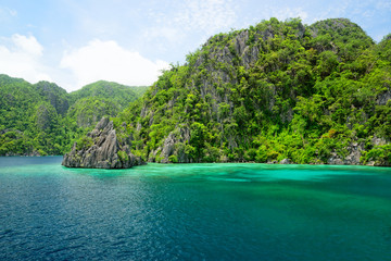 Coron Island in the Calamian group is a popular tourist destination at the Philippines, known for its beautiful inner lakes and for diving and snorkeling spots around it