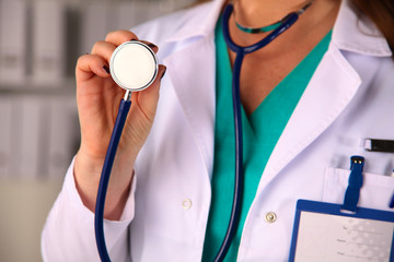 Portrait of happy medical doctor woman in office