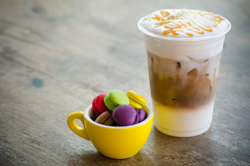 ice macchiato coffee and macaroons in cup