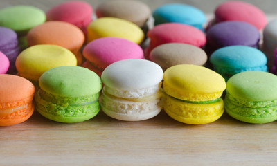 colourful tasty macaroons in a row