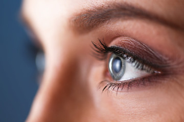 Obraz premium A beautiful woman, portrait isolated on blue background