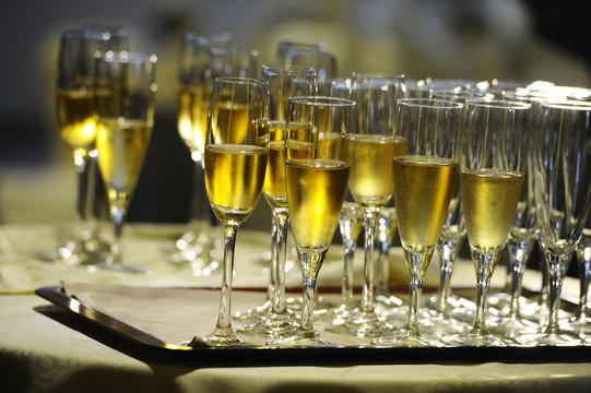 Champagne flautes prepared for a wedding reception
