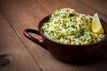 Turkish traditional meal - Taboulé Salad on a wooden table made