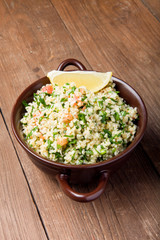 Turkish traditional meal - Taboulé Salad on a wooden table made
