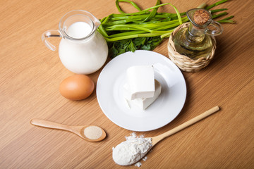 White cheese, milk, egg, olive oil, green onion and spices - ing