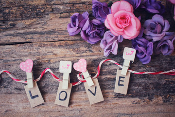 Word LOVE with roses