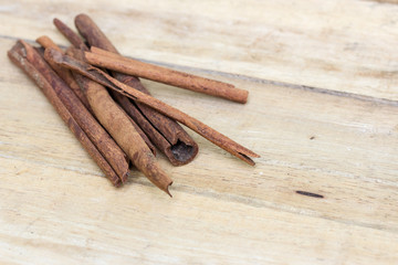 cinnamon sticks on  wooden table