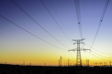 Electric powerlines over sunrise