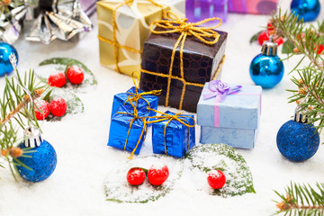 Christmas decoration and box gifts on snow background