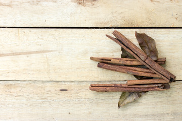 cinnamon and herb sticks on  wooden table