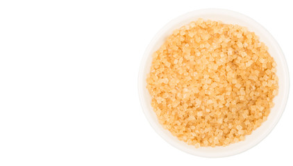 Brown sugar in white bowl over white background