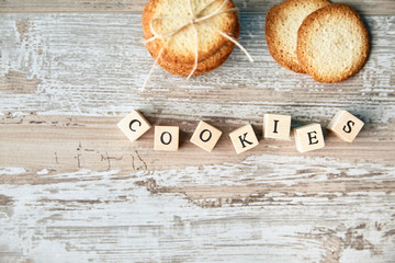 Top view of stack cookies and focused letters in morning light