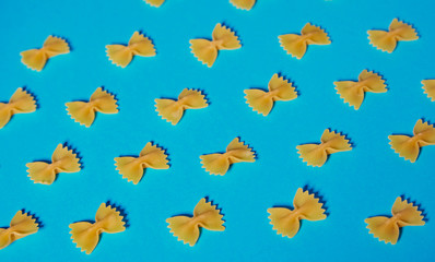 Farfale pasta pattern on turquoise background short shadow