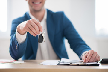 Skillful estate agent is working at office