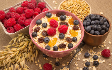 Healthy porridge with fruits on canvas