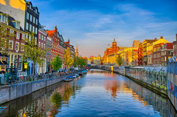 Fototapeta premium Amstel river with beautiful houses in Amsterdam, Holland, Nether