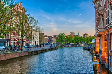 Amstel river with beautiful houses in Amsterdam, Holland, Nether
