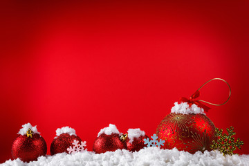 Merry Christmas concept balls in snow, greeting