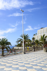 Fototapeta na wymiar Promenade along the Atlantic ocean beach in Taurito, Gran Canaria Island.