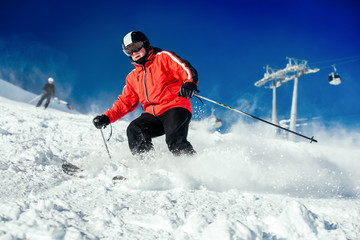 Skier skiing on ski slope