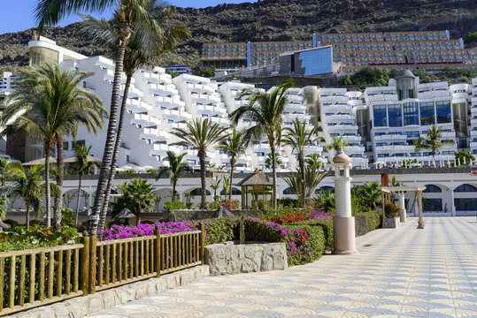 Promenade along the Atlantic ocean beach in Taurito, Gran Canaria Island.