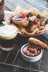 Roasted chicken wings and dark beer