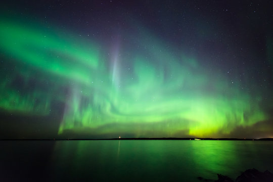 Northern lights over lake in finland