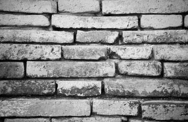 The old grey brick wall texture and background