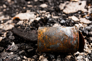 Obraz premium Tin can on burned ground