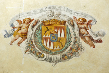 Ancient coat of arms on the Church wall, lake Bled island in Slovenia