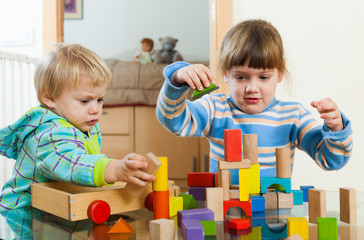 Two  children playing with  blocks