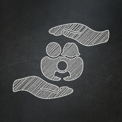 Insurance concept: Family And Palm on chalkboard background