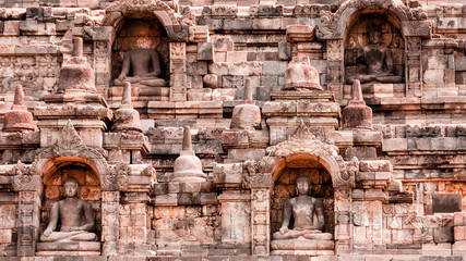 Four Sitting Buddha carved in Stone at Borobudur