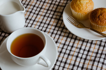 Cup of Tea with Milk and Cup Cake for Tea Break.