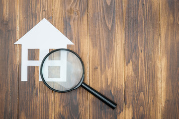 paper house with Magnifying Glass, House hunting