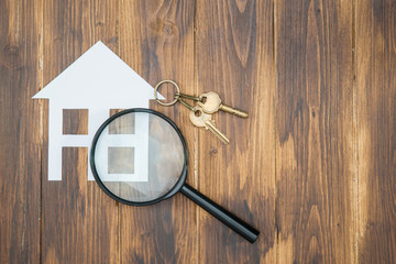 paper house and key with Magnifying Glass, House hunting