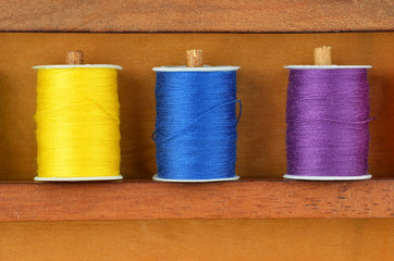 Threads on wooden box