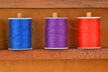 Threads on wooden box